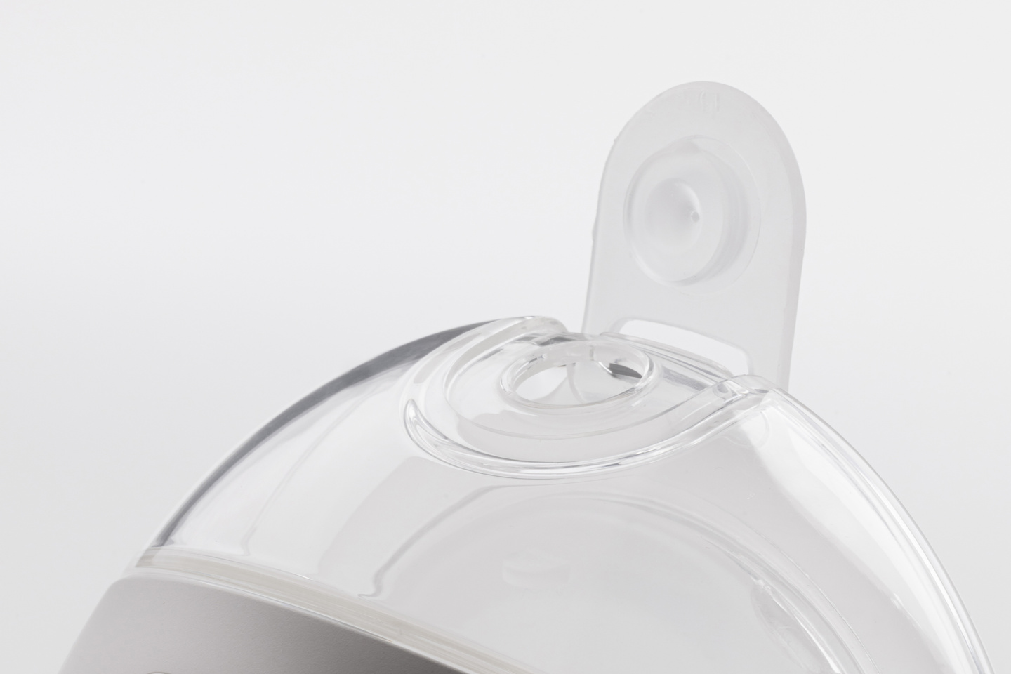 Small studio shot of the white Avira breast pump unit on a plain background.