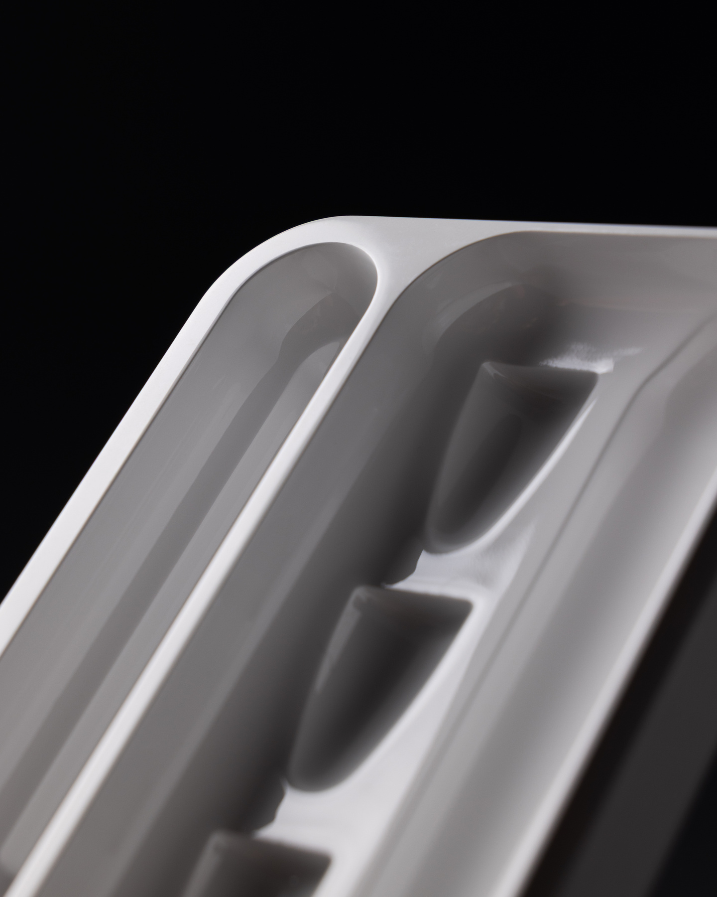 Close-up view of the internal storage slots inside a metallic smart insulin pen case