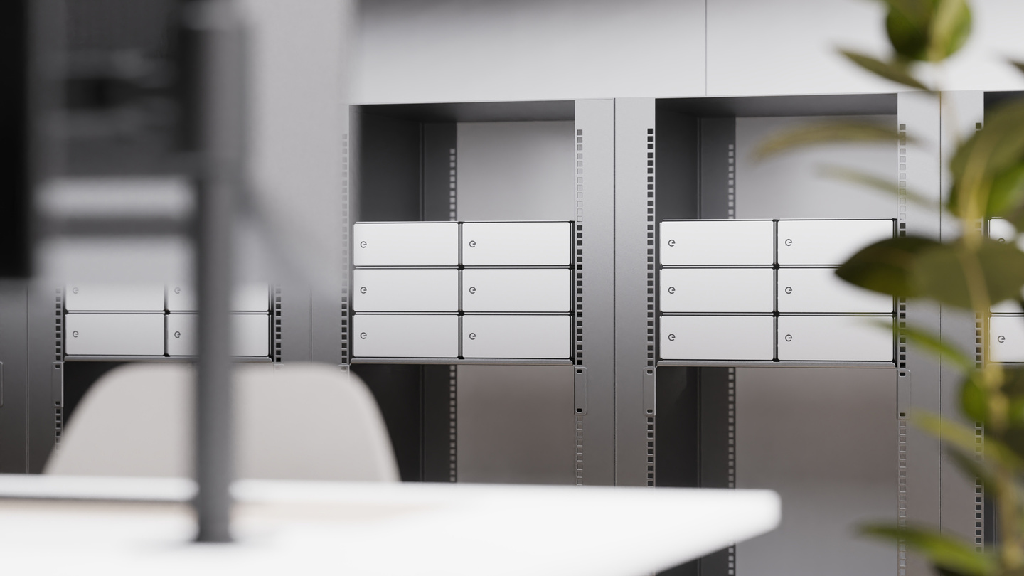Interior office environment featuring white modular hardware enclosures integrated into workspace