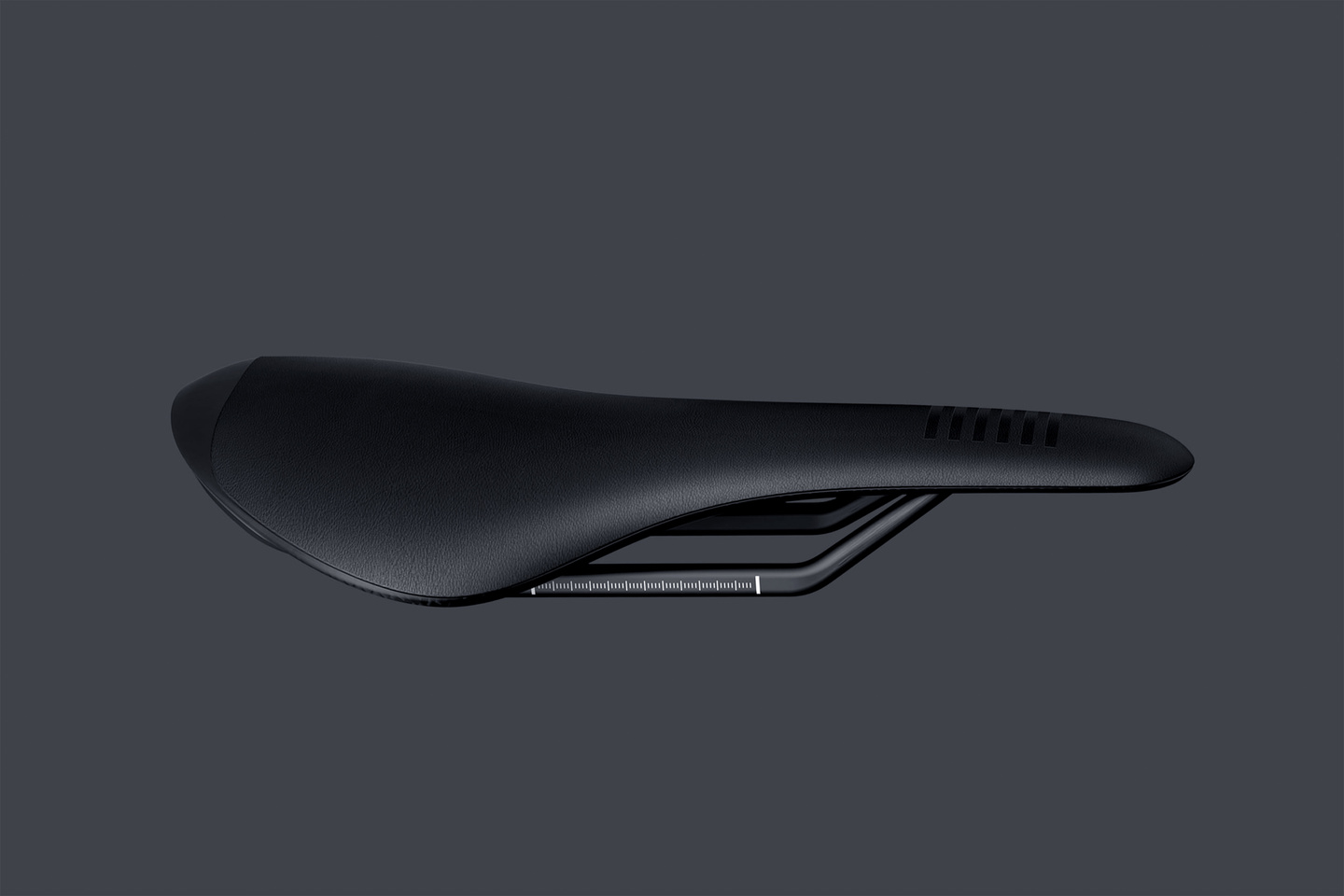 Side profile view of a streamlined black bicycle saddle against a grey background