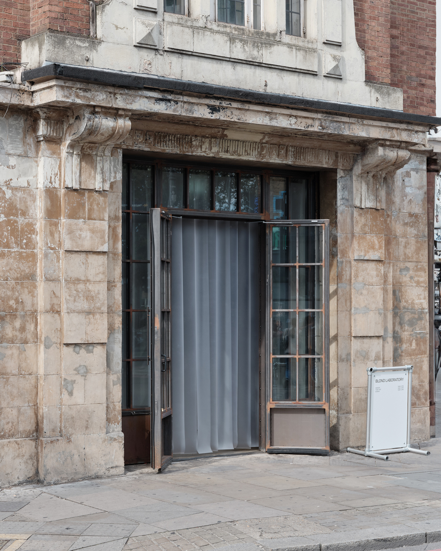 Stone building entrance door leading to exhibition venue