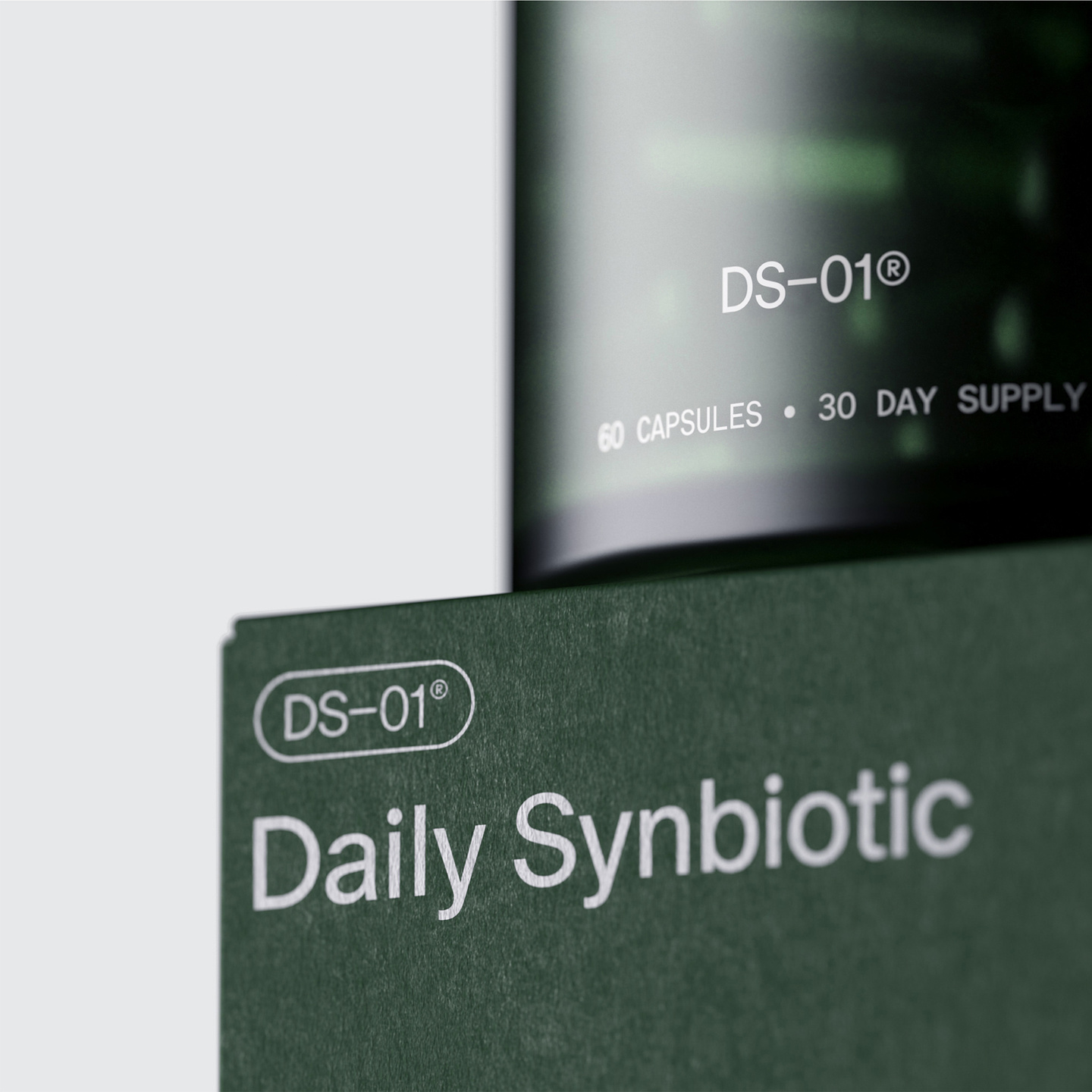 Dark green box with Daily Synbiotic text beside a glass jar