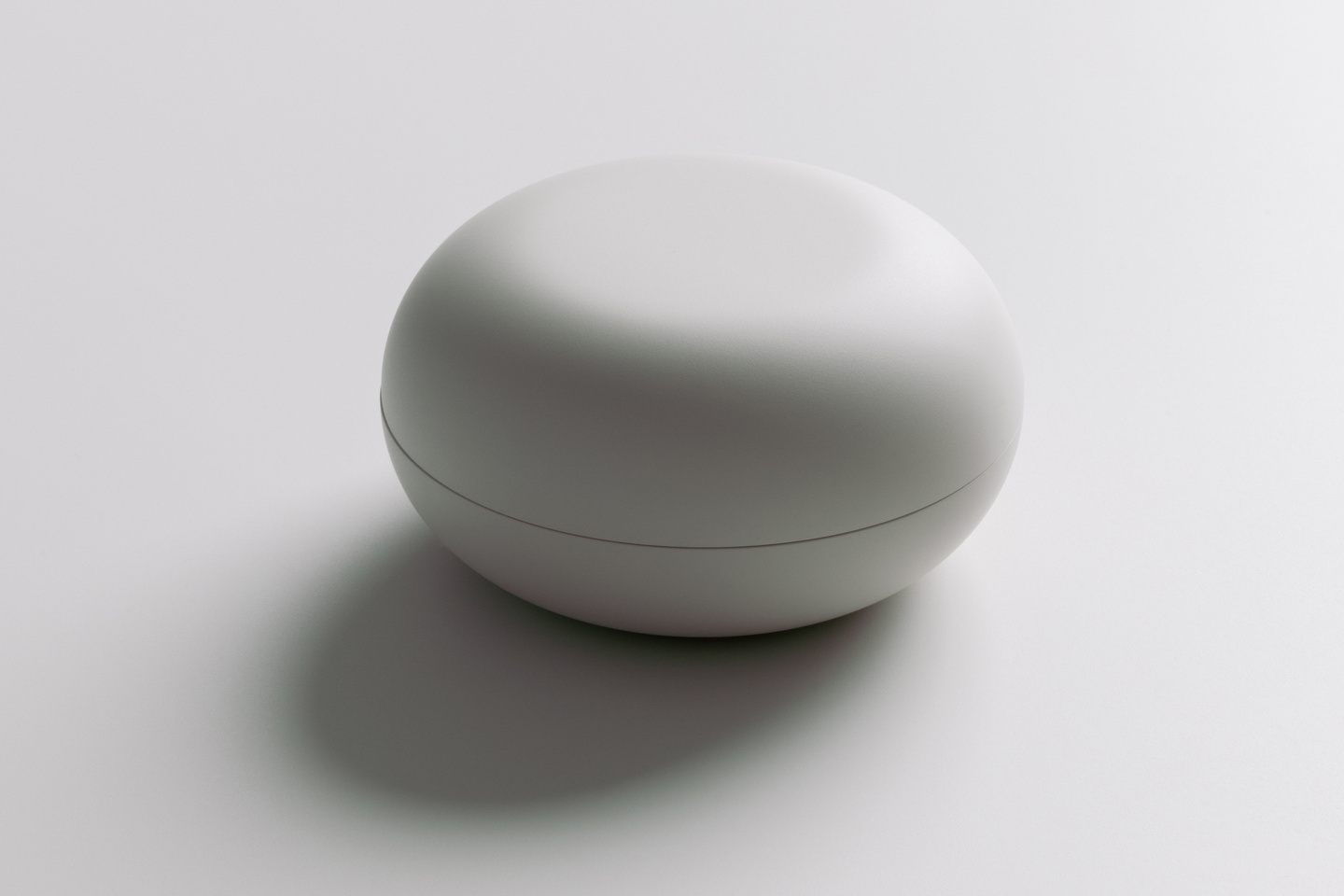 Small studio shot of the compact Avira wearable breast pump unit.