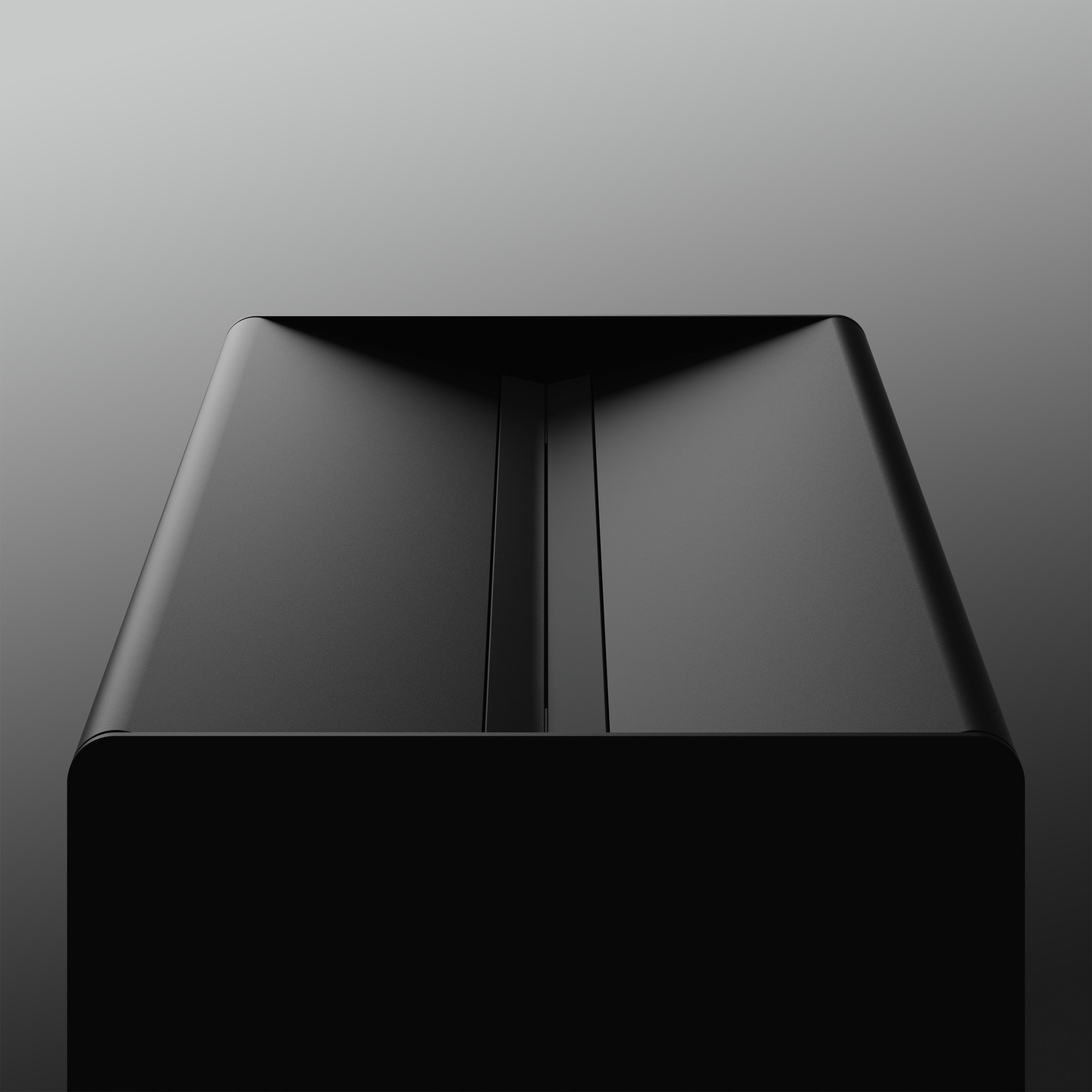 Matte black rectangular wet wipes dispenser box viewed from above against a dark backdrop