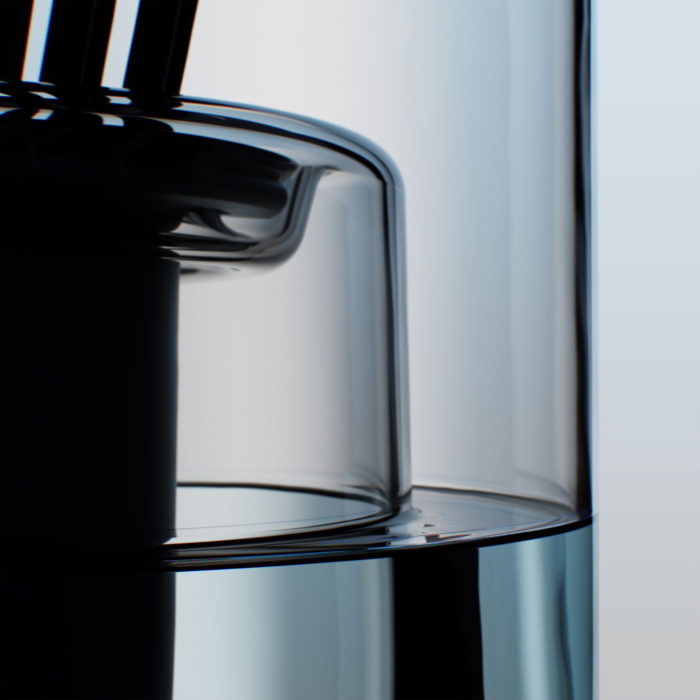 Close-up of a clear glass reed diffuser vessel with fluid inside