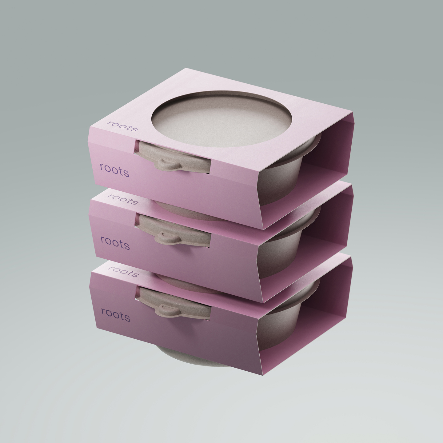 Three stacked pink paperboard packaging boxes with circular cut-outs on top.