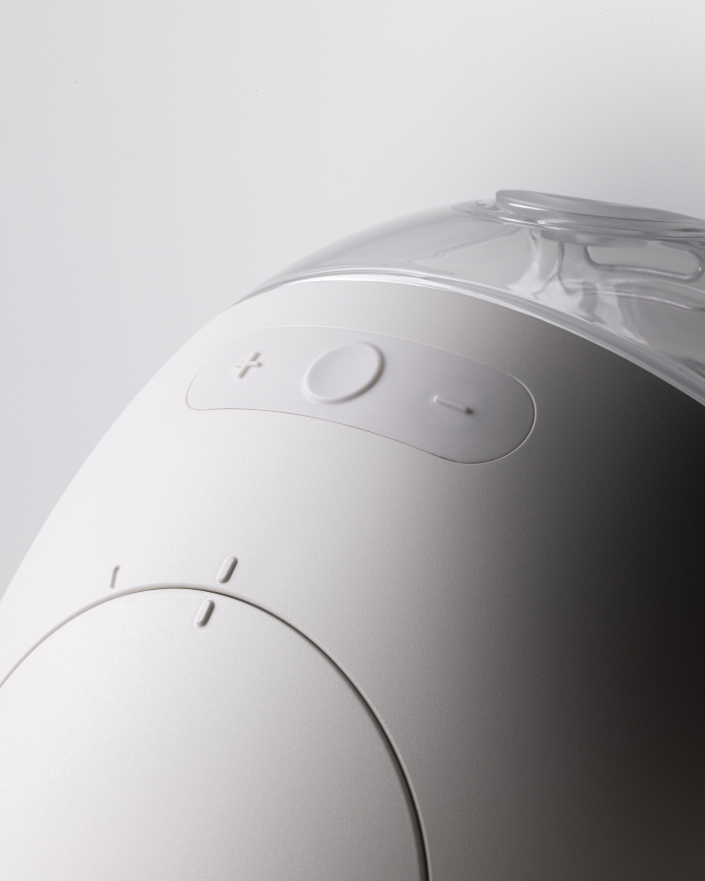 Detailed close-up of the control buttons and status indicators on the pump shell.