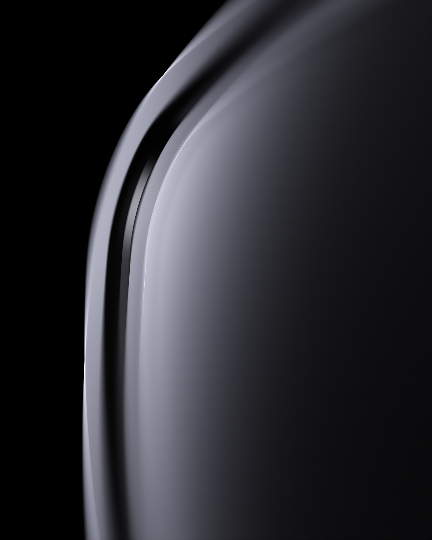 Profile view of a smooth, glossy black device curved edge
