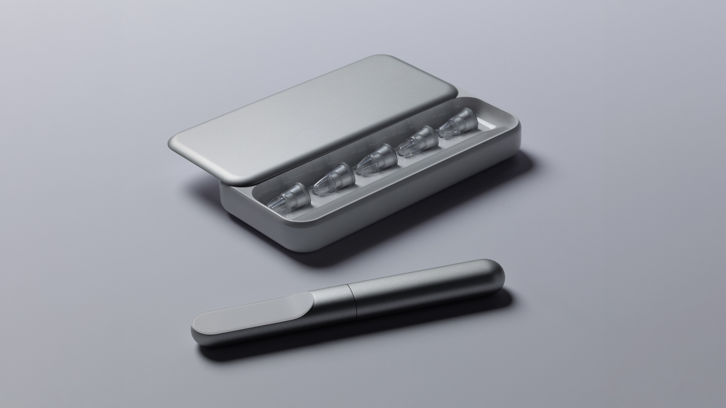 Metallic smart insulin pen resting next to its open compact grey carrying case