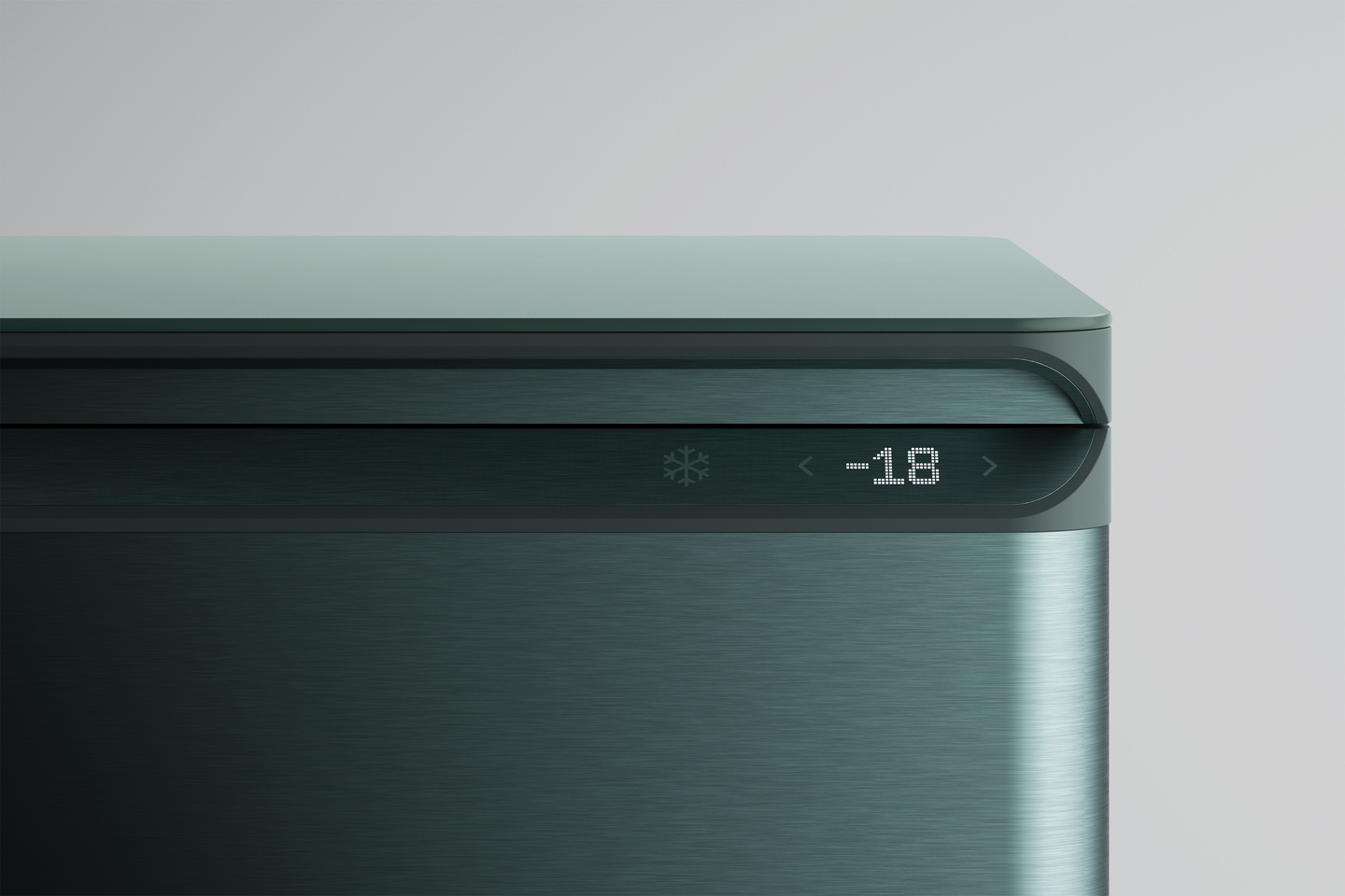 Close-up view of a sleek dark appliance interface with digital display text